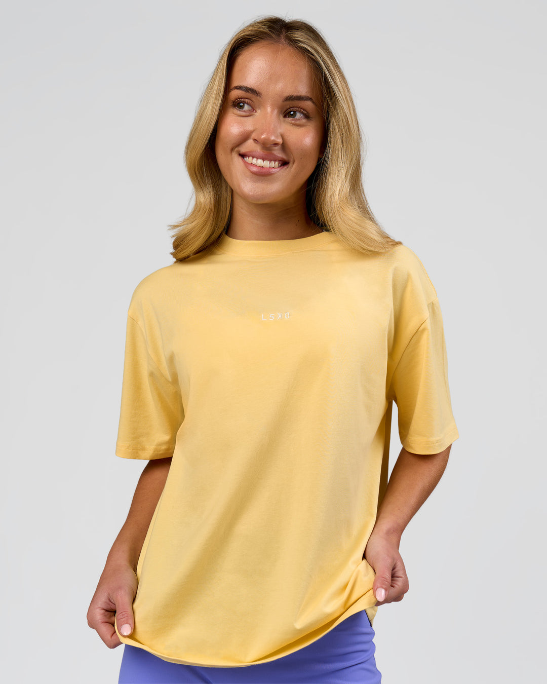 Woman wearing Go-To FLXCotton Oversized Tee - Lemon-White | Model:Issy | Size:XS - view 1