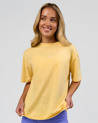 Woman wearing Go-To FLXCotton Oversized Tee - Lemon-White | Model:Issy | Size:XS | Thumbnail Index: 0