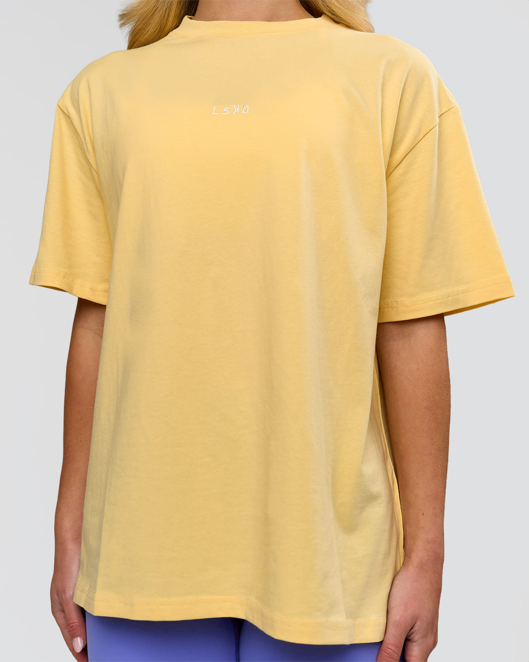 Woman wearing Go-To FLXCotton Oversized Tee - Lemon-White | Model:Issy | Size:XS - view 3