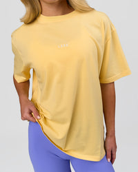 Woman wearing Go-To FLXCotton Oversized Tee - Lemon-White | Model:Issy | Size:XS | Thumbnail Index: 4