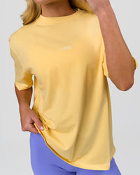 Woman wearing Go-To FLXCotton Oversized Tee - Lemon-White | Model:Issy | Size:XS | Thumbnail Index: 5