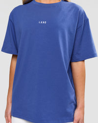 Woman wearing Go-To FLXCotton Oversized Tee - Power Cobalt-White | Model:Issy | Size:XS | Thumbnail Index: 1