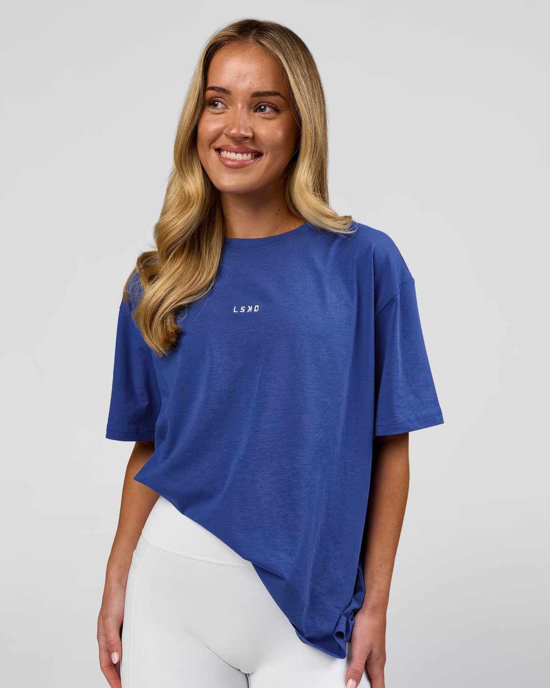 Woman wearing Go-To FLXCotton Oversized Tee - Power Cobalt-White | Model:Issy | Size:XS - view 7