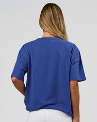 Woman wearing Go-To FLXCotton Oversized Tee - Power Cobalt-White | Model:Issy | Size:XS | Thumbnail Index: 7