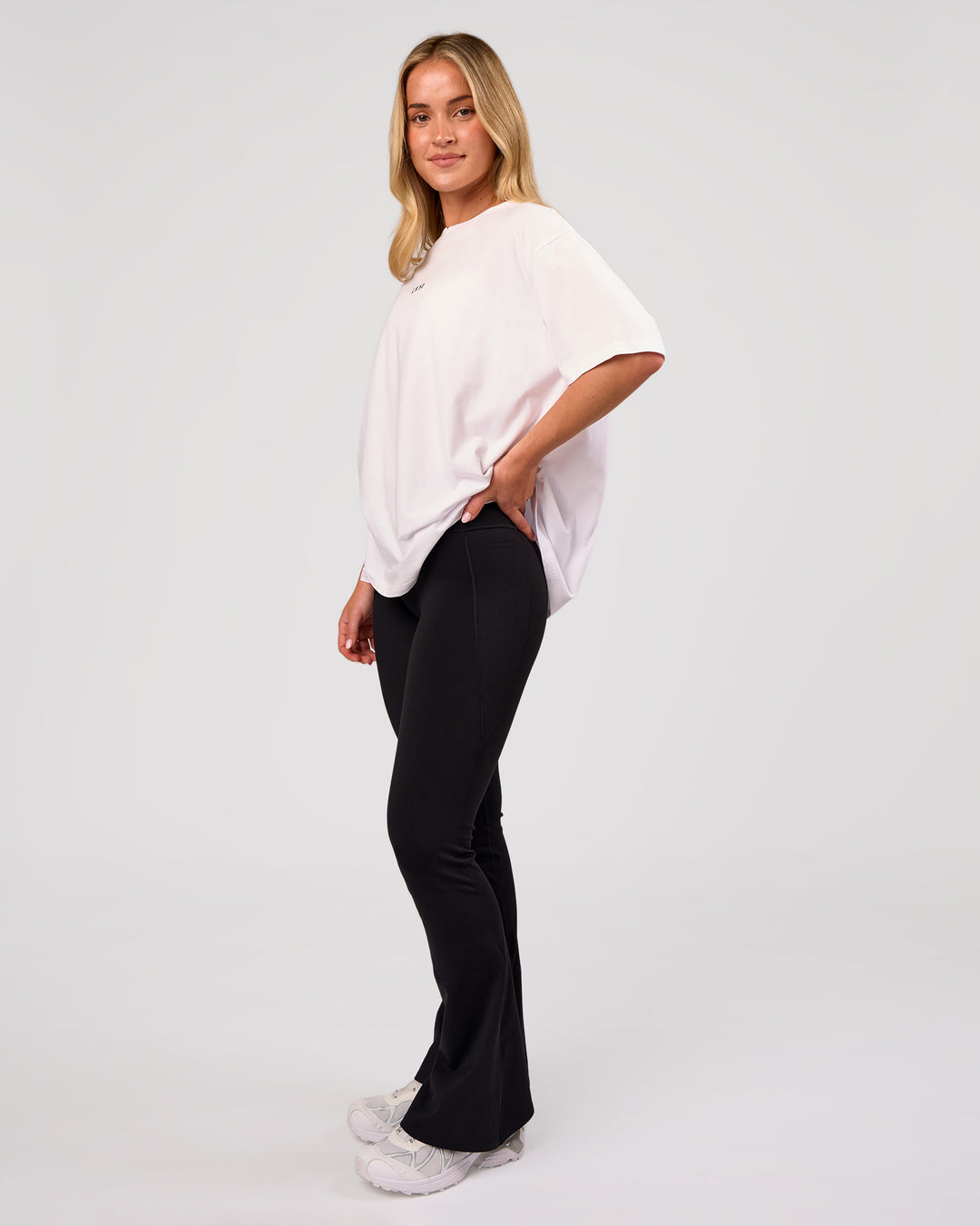 Woman wearing Go-To FLXCotton Oversized Tee - White-Black | Model:Issy | Size:XS - view 5