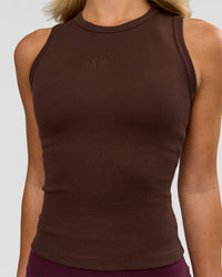 Woman wearing Go-To FLXCotton Rib High Neck Tank - Hot Chocolate | Model:Issy | Size:XS | Thumbnail Index: 1