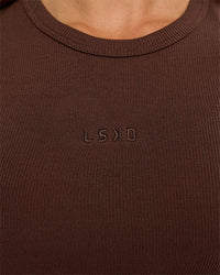 Woman wearing Go-To FLXCotton Rib High Neck Tank - Hot Chocolate | Model:Issy | Size:XS | Thumbnail Index: 2