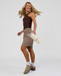 Woman wearing Go-To FLXCotton Rib High Neck Tank - Hot Chocolate | Model:Issy | Size:XS | Thumbnail Index: 4