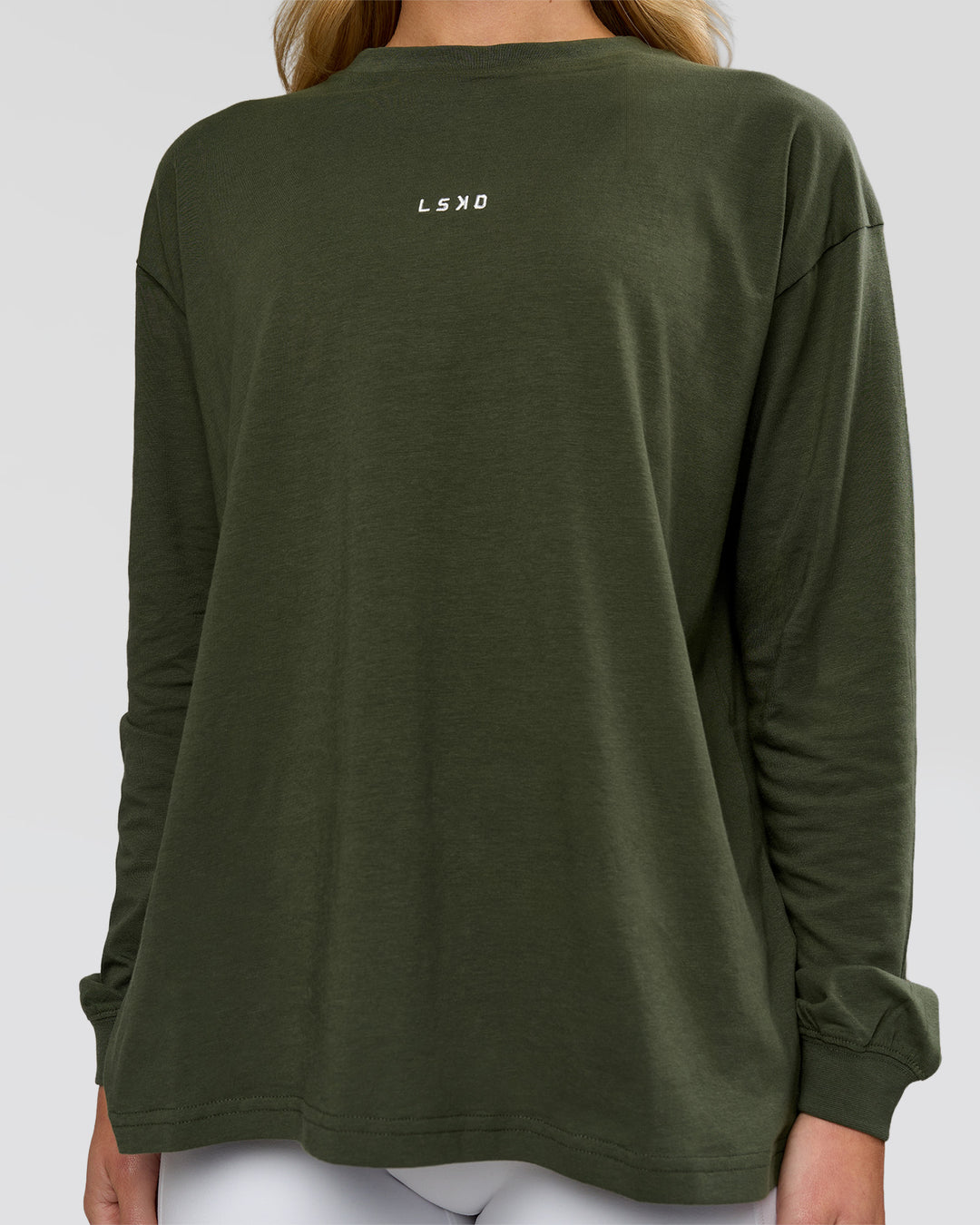 Woman wearing Go-To Long Sleeve FLXCotton Oversized Tee - Pure Olive-White | Model:Issy | Size:XS - view 3