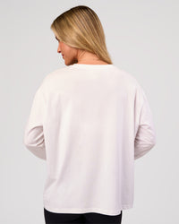 Woman wearing Go-To Long Sleeve FLXCotton Oversized Tee - White-Black | Model:Issy | Size:XS | Thumbnail Index: 3