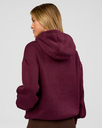 Woman wearing Go-To Oversized Hoodie - Cherry Lacquer | Model:Issy | Size:XS | Thumbnail Index: 1