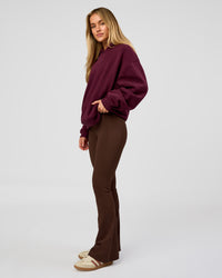 Woman wearing Go-To Oversized Hoodie - Cherry Lacquer | Model:Issy | Size:XS | Thumbnail Index: 4