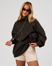 Woman wearing Go-To Oversized Mock Neck Sweater - Ground Coffee | Model:Issy | Size:XS | Thumbnail Index: 0