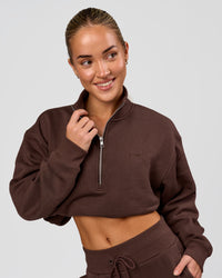Woman wearing Go-To Oversized Quarter Zip Sweater - Hot Chocolate | Model:Issy | Size:XS