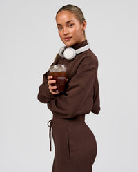 Woman wearing Go-To Oversized Quarter Zip Sweater - Hot Chocolate | Model:Issy | Size:XS