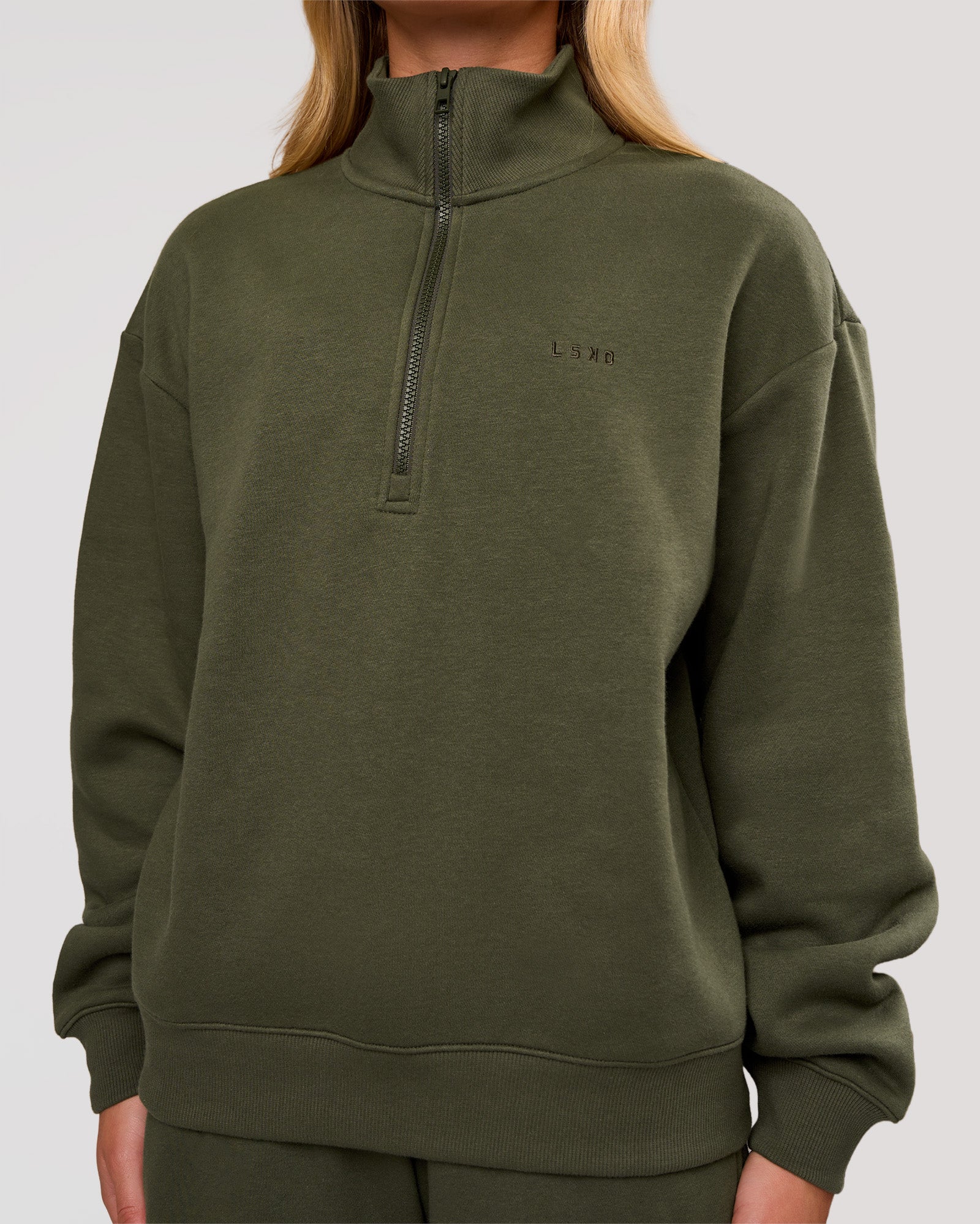 Woman wearing Go-To Oversized Quarter Zip Sweater - Pure Olive | Model:Issy | Size:XS