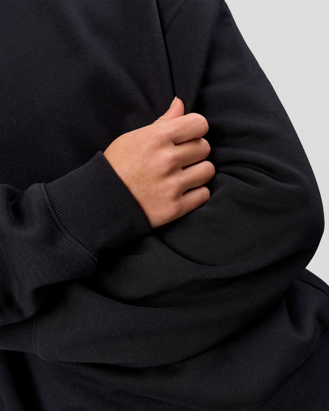 Woman wearing Go-To Oversized Sweater - Black | Model:Issy | Size:XS