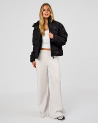 Woman wearing Go-To Puffer Jacket - Black | Model:Issy | Size:XS | Thumbnail Index: 2