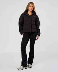 Woman wearing Go-To Puffer Jacket - Black | Model:Issy | Size:XS | Thumbnail Index: 6