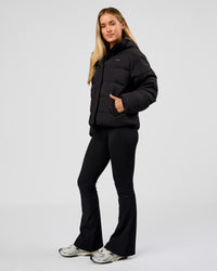 Woman wearing Go-To Puffer Jacket - Black | Model:Issy | Size:XS | Thumbnail Index: 8