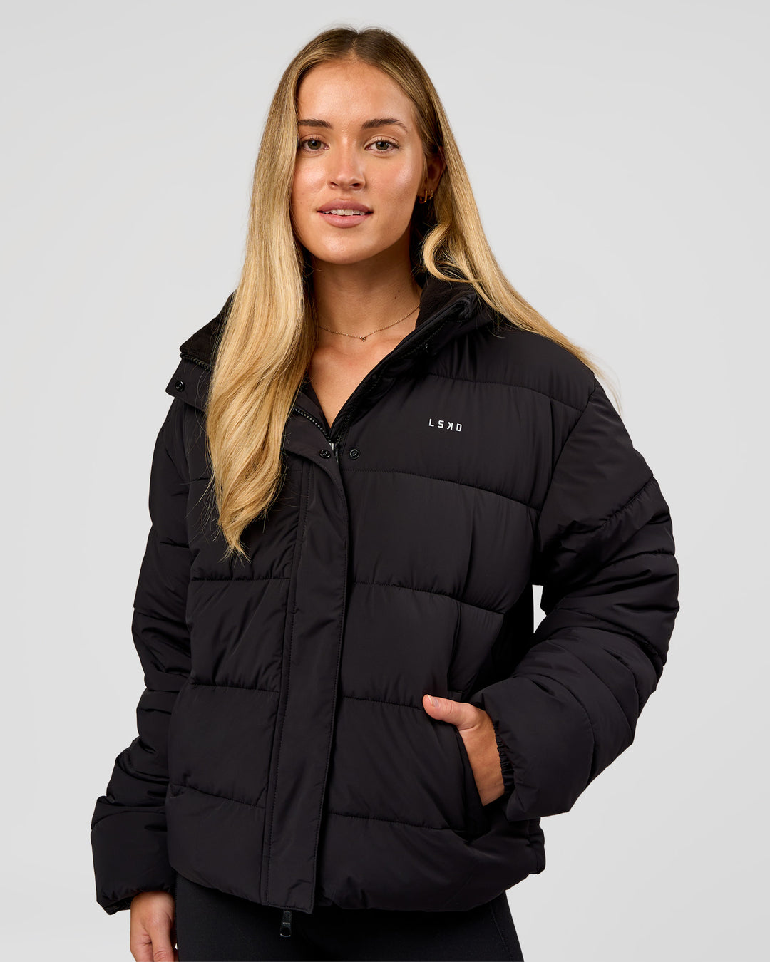 Woman wearing Go-To Puffer Jacket - Black | Model:Issy | Size:XS - view 1