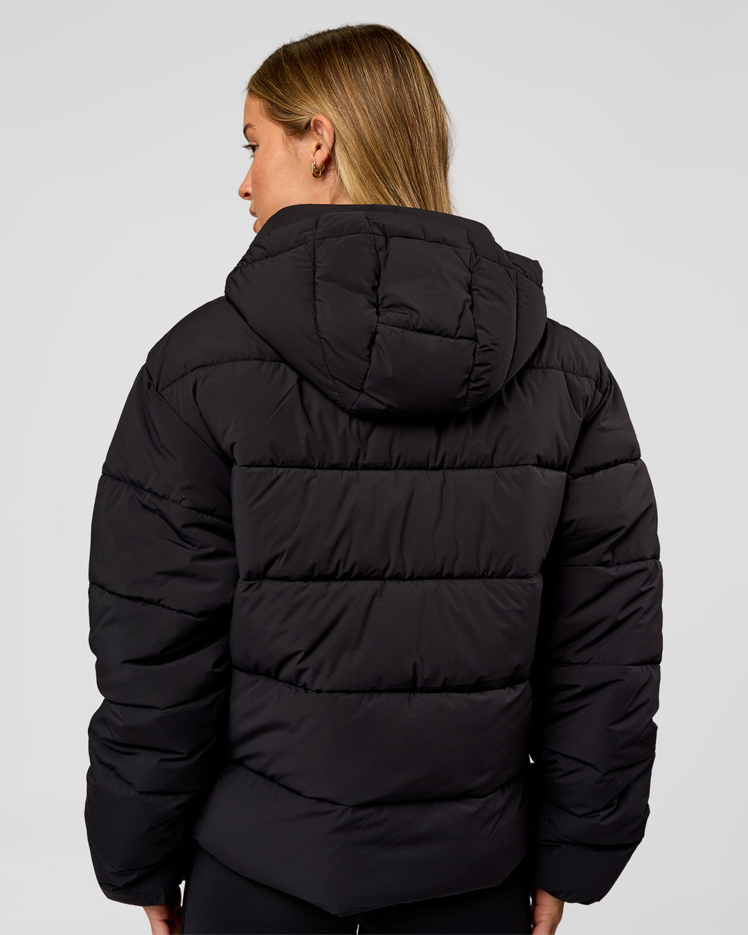 Woman wearing Go-To Puffer Jacket - Black | Model:Issy | Size:XS - view 2