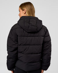 Woman wearing Go-To Puffer Jacket - Black | Model:Issy | Size:XS | Thumbnail Index: 1