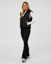 Woman wearing Go-To Puffer Vest - Black | Model:Issy | Size:XS