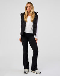Woman wearing Go-To Puffer Vest - Black | Model:Issy | Size:XS