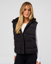 Woman wearing Go-To Puffer Vest - Black | Model:Issy | Size:XS
