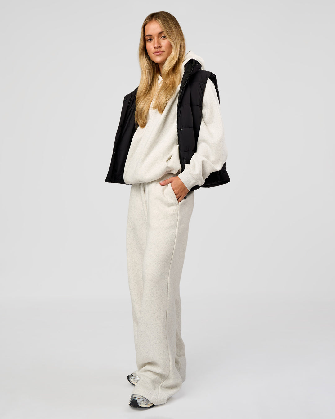 Woman wearing Go-To Puffer Vest - Black | Model:Issy | Size:XS