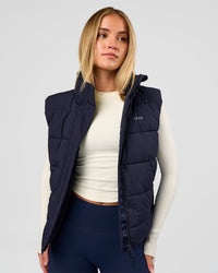 Woman wearing Go-To Puffer Vest - Future Navy | Model:Issy | Size:XS