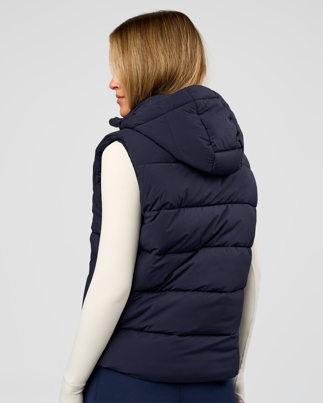 Woman wearing Go-To Puffer Vest - Future Navy | Model:Issy | Size:XS