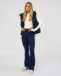 Woman wearing Go-To Puffer Vest - Future Navy | Model:Issy | Size:XS