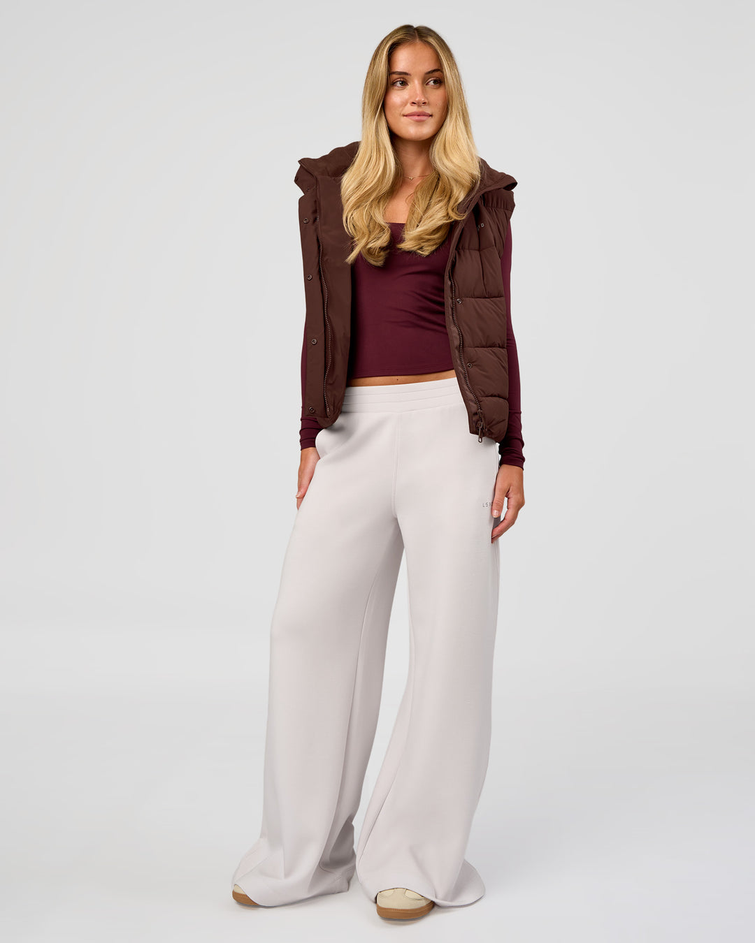Woman wearing Go-To Puffer Vest - Hot Chocolate | Model:Issy | Size:XS