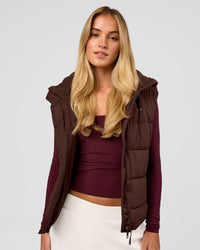 Woman wearing Go-To Puffer Vest - Hot Chocolate | Model:Issy | Size:XS