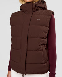 Woman wearing Go-To Puffer Vest - Hot Chocolate | Model:Issy | Size:XS