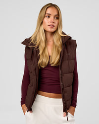 Woman wearing Go-To Puffer Vest - Hot Chocolate | Model:Issy | Size:XS