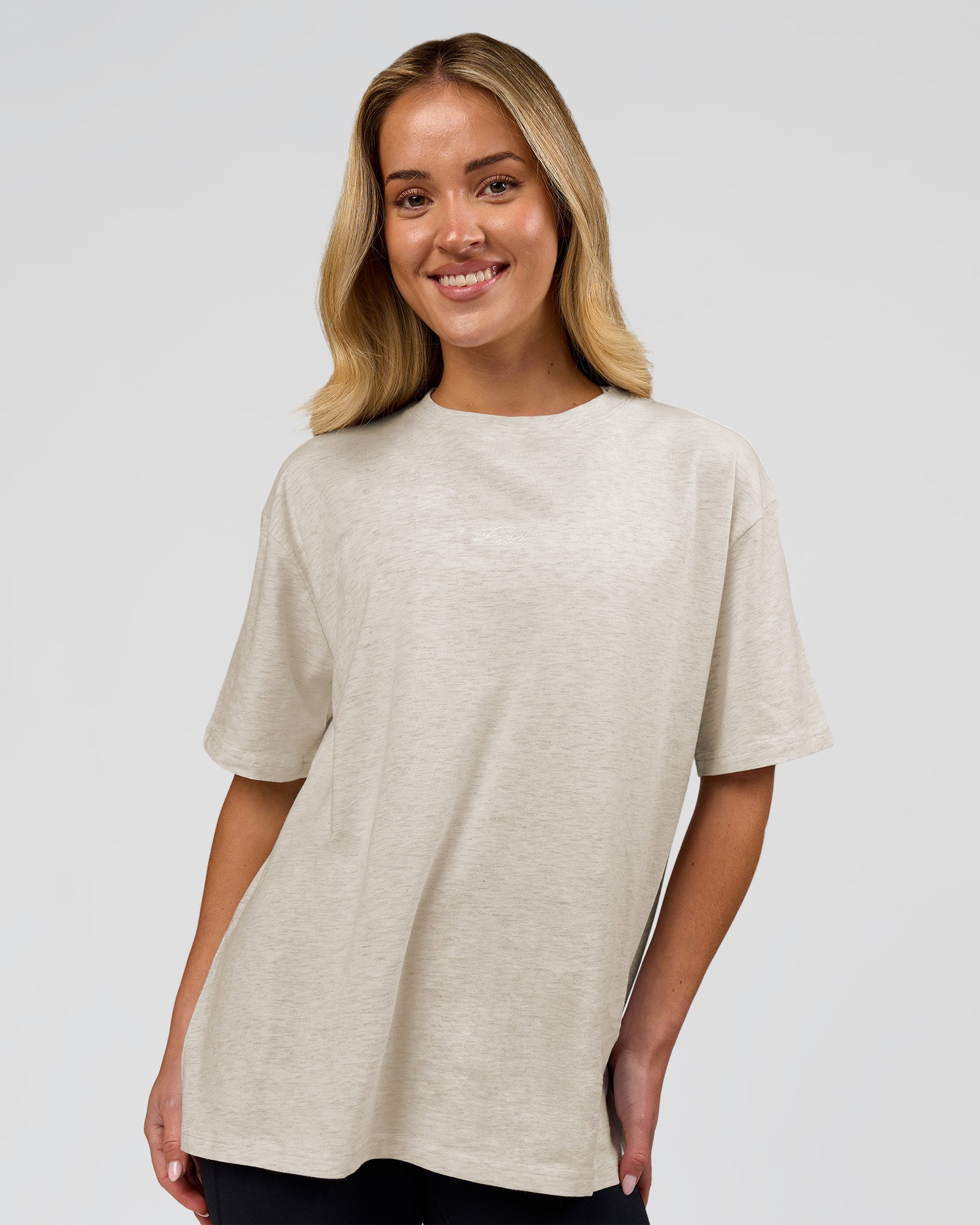 Woman wearing Go-To Script FLXCotton Oversized Tee - Silver Marl-White | Model:Issy | Size:XS