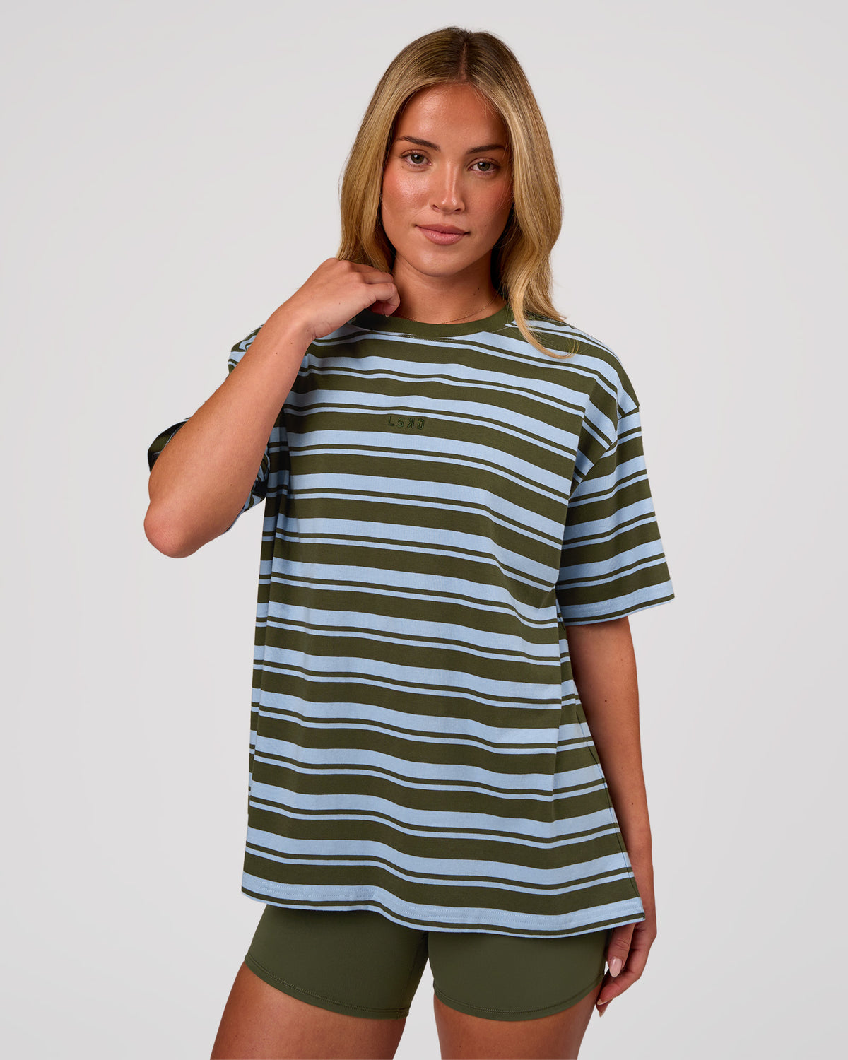 Woman wearing Go-To Shadow Stripe FLXCotton Oversized Tee - Pure Olive-Open Air | Model:Issy | Size:XS