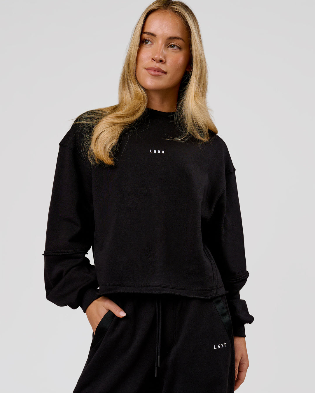 Woman wearing Go-To Terry Oversized Pull Over - Black-White | Model:Issy | Size:XS - view 1