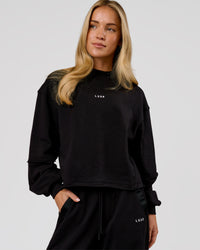 Woman wearing Go-To Terry Oversized Pull Over - Black-White | Model:Issy | Size:XS | Thumbnail Index: 0