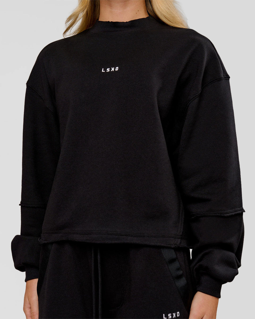 Woman wearing Go-To Terry Oversized Pull Over - Black-White | Model:Issy | Size:XS - view 2
