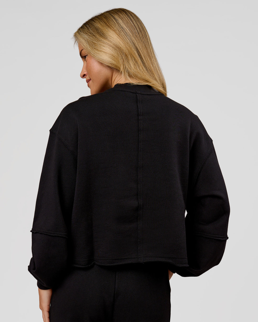 Woman wearing Go-To Terry Oversized Pull Over - Black-White | Model:Issy | Size:XS - view 4