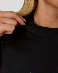 Woman wearing Go-To Terry Oversized Pull Over - Black-White | Model:Issy | Size:XS | Thumbnail Index: 4