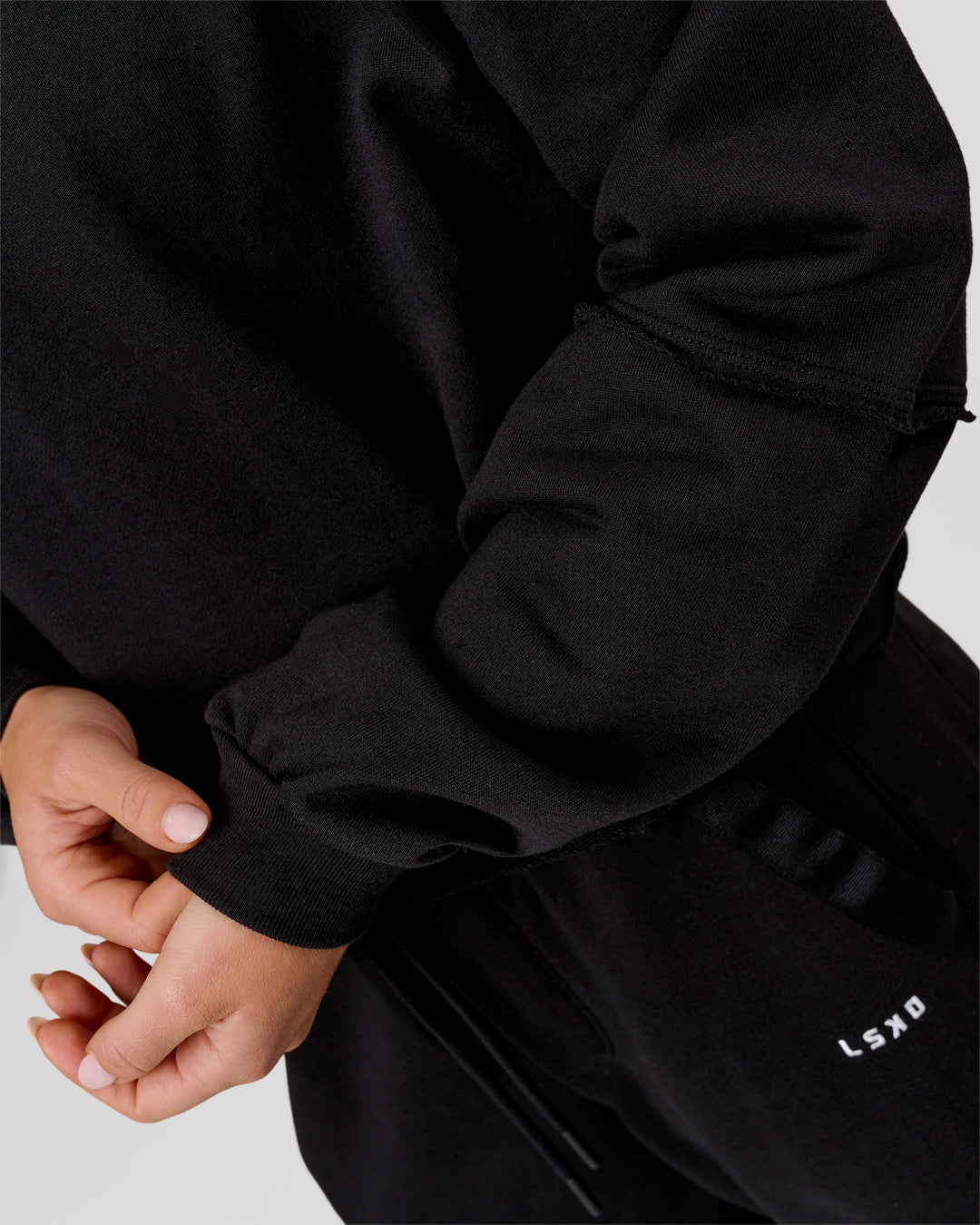Woman wearing Go-To Terry Oversized Pull Over - Black-White | Model:Issy | Size:XS - view 8