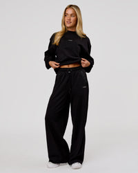 Woman wearing Go-To Terry Oversized Pull Over - Black-White | Model:Issy | Size:XS | Thumbnail Index: 8