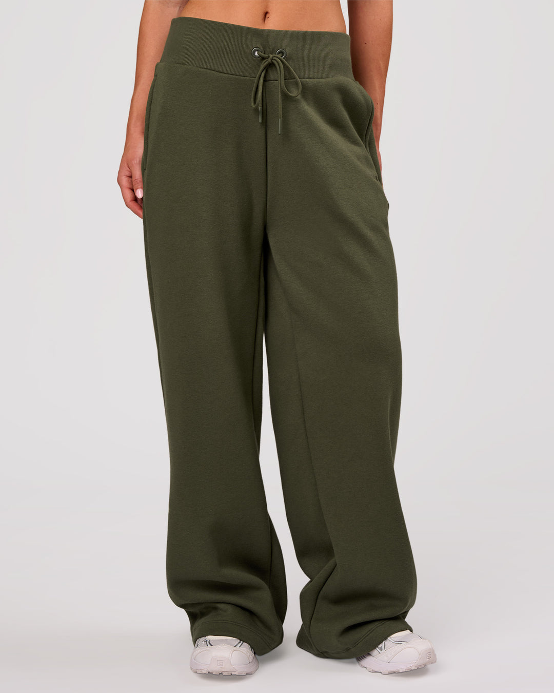 Woman wearing Go-To Wide Leg Track Pant - Pure Olive | Model:Issy | Size:XS - view 1