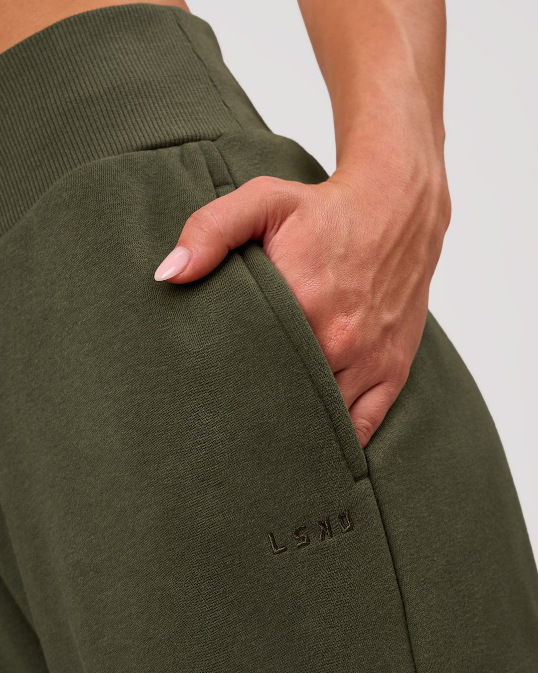 Woman wearing Go-To Wide Leg Track Pant - Pure Olive | Model:Issy | Size:XS - view 3