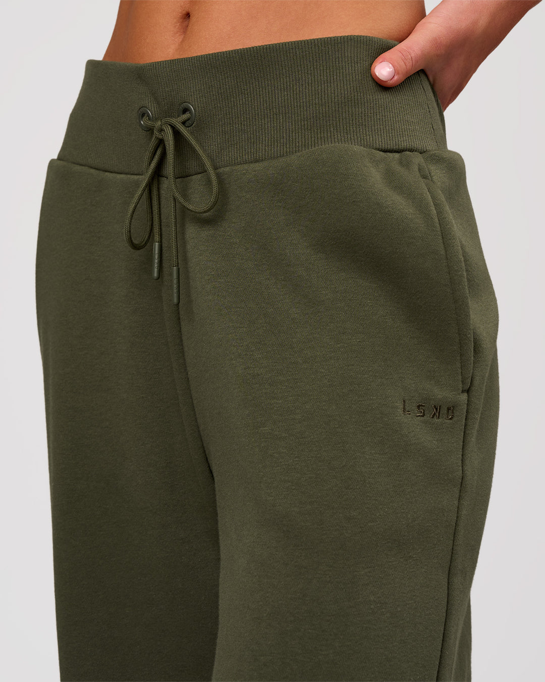 Woman wearing Go-To Wide Leg Track Pant - Pure Olive | Model:Issy | Size:XS - view 4